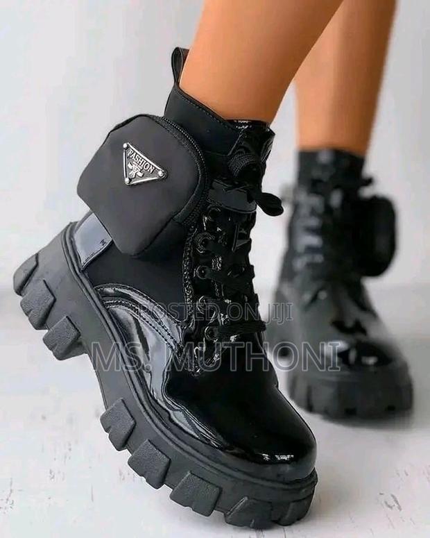 Black Patent Leather Prada Monolith Boots With a Detachable Pouch. - main view