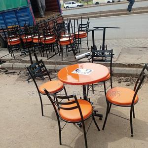 Branded Restaurant/Hotel Table With Orange Chairs. - main view
