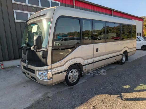 Toyota Coaster 2019 Beige - thumbnail 2