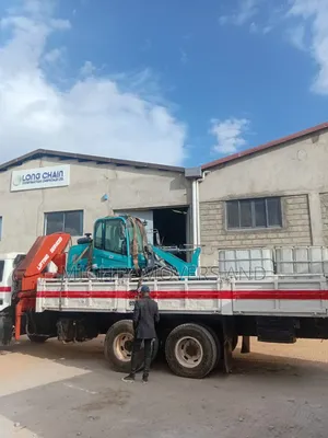 Lifting Cranes With Lorries Are Ready for Jobs and Errands