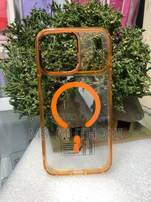 iPhone 17 Pro Max With an Orange Frame and Magsafe Compatibility. - main view