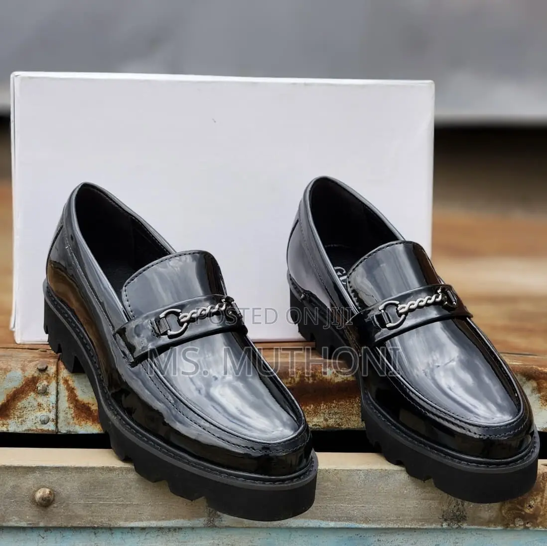 Black Patent Leather Chunky Loafers With a Metal Chain Accent