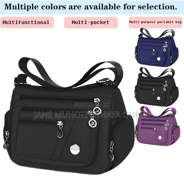 *Multi-Comnartment Cross Body Bag*