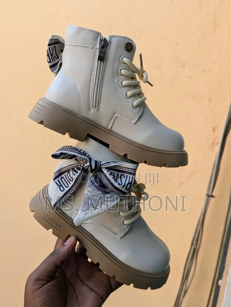 Beige /Black Girls' Boots With a Decorative Scarf Accent.