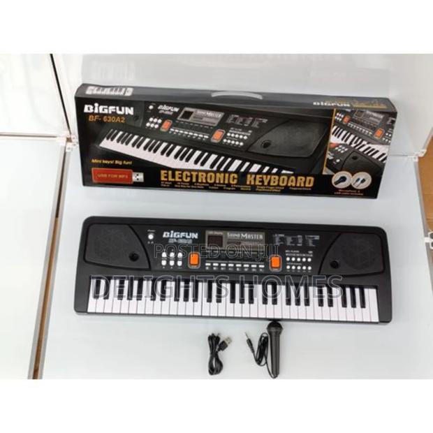 Electric Piano With Microphone and Charging Cable - main view