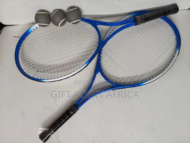 A Pair Of Long Tennis Rackets With 3 Tennis Balls And Free Bag