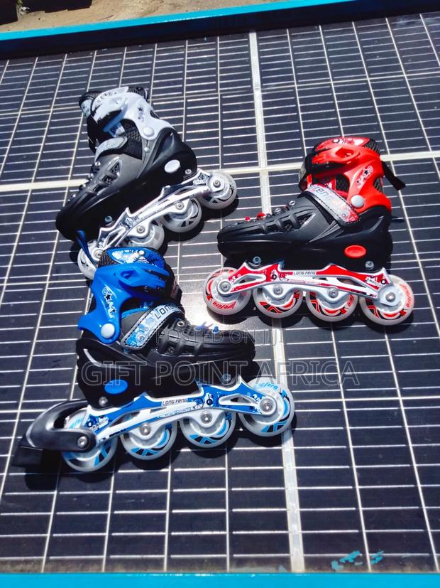 Adjustable Hard Boot Skating Shoes With Rubber Wheels For Kids - thumbnail 2