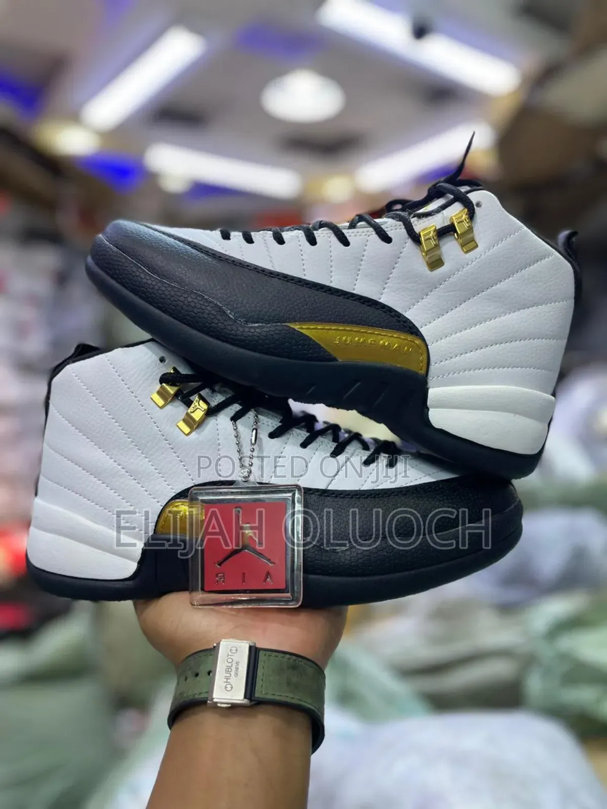 Air Jordan 12 Retro "Royalty Taxi" Sneakers.