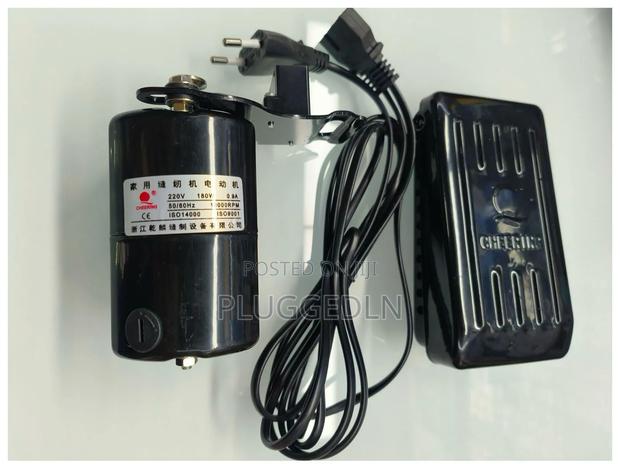 Cheering Domestic Sewing Machine Motor With a Foot Pedal Controller.