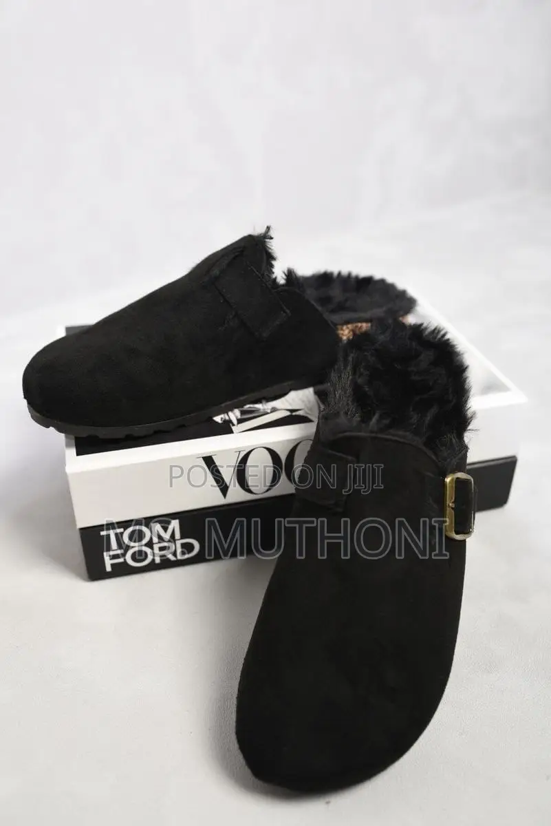 Black Suede Clogs With a Fur Lining and Buckle Detail,