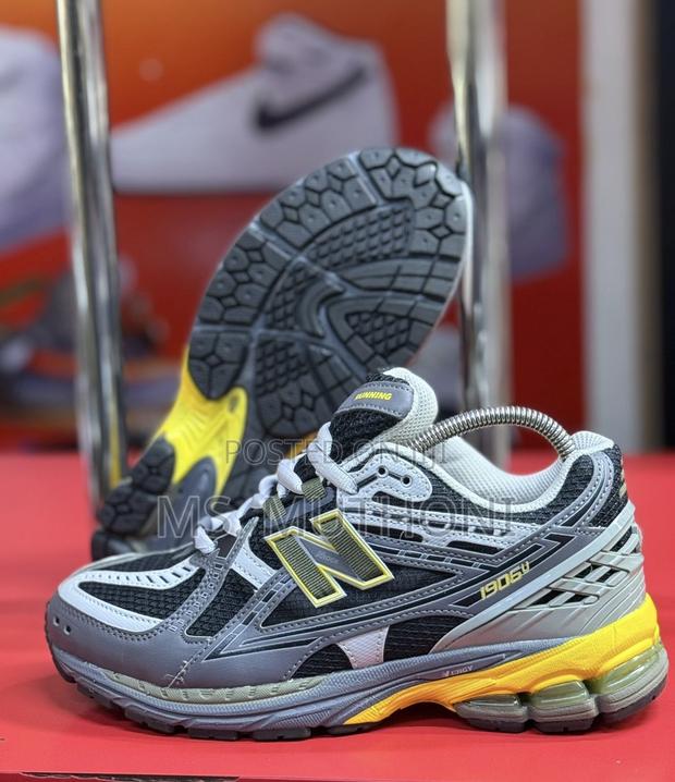Castlerock, Ginger Lemon, and Phantom New Balance 1906u - main view