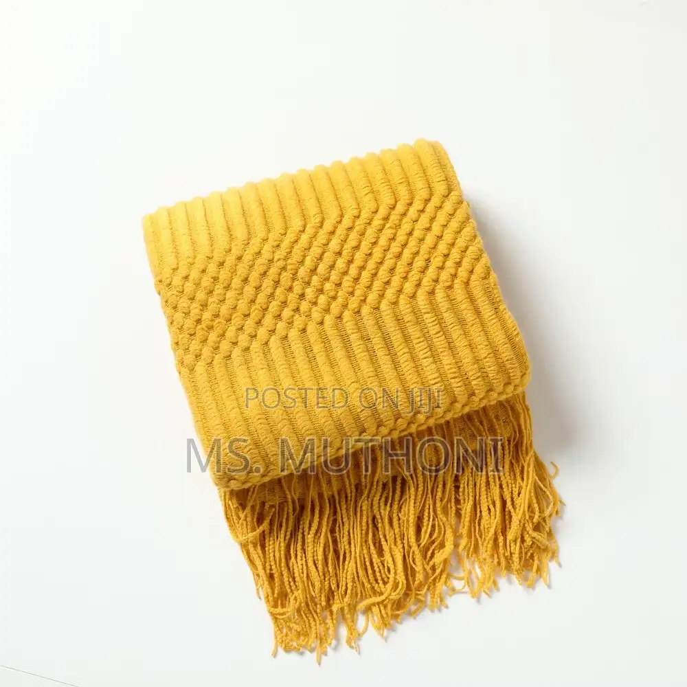 Textured Soft Knitted Throw Blanket With Tassels.