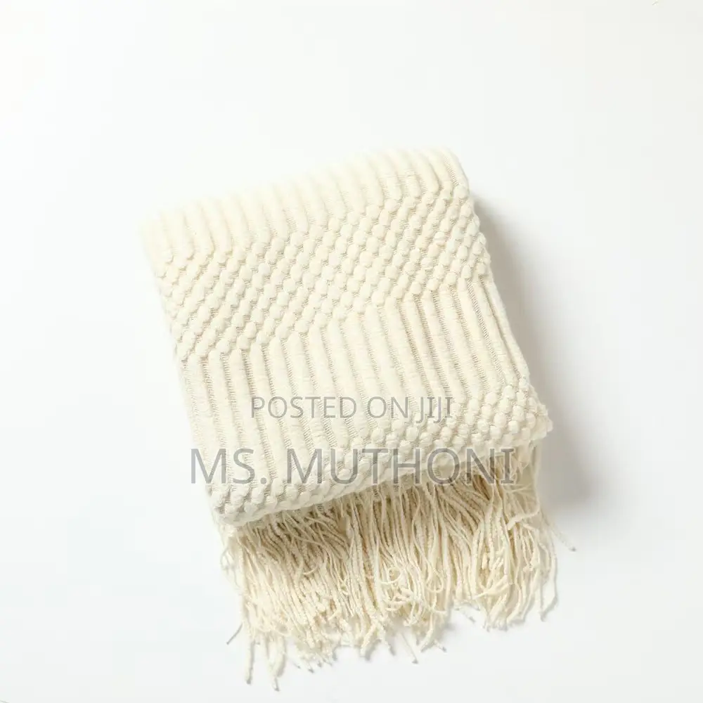 Textured Soft Knitted Throw Blanket With Tassels.