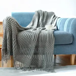 Textured Soft Knitted Throw Blanket With Tassels.