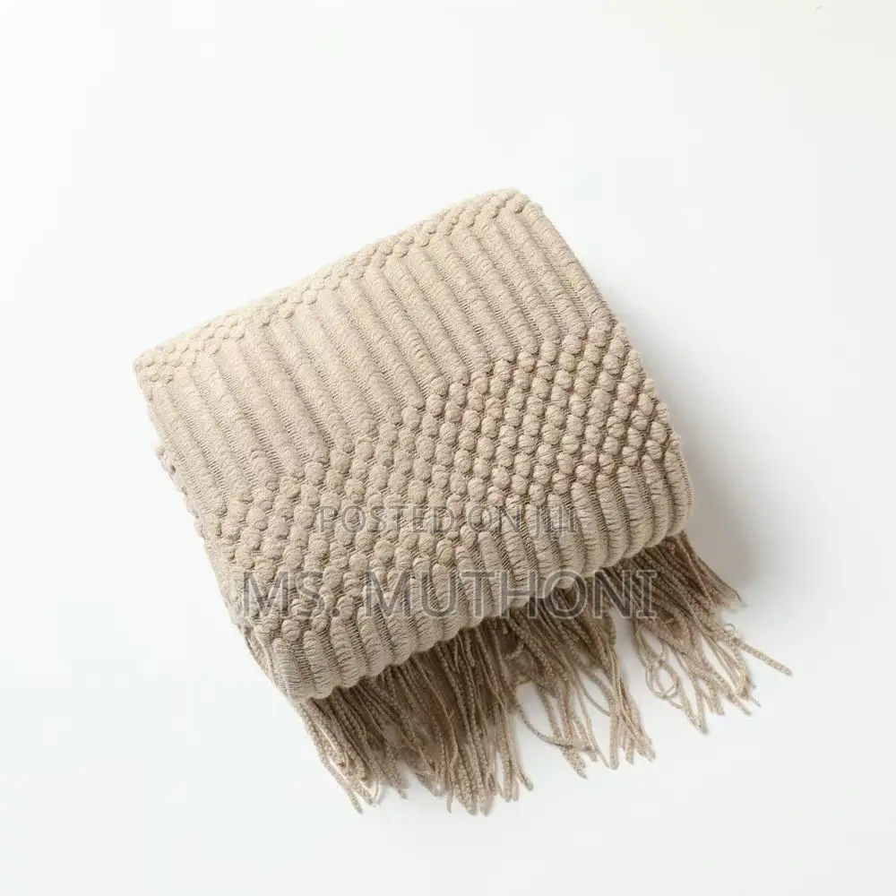 Textured Soft Knitted Throw Blanket With Tassels.