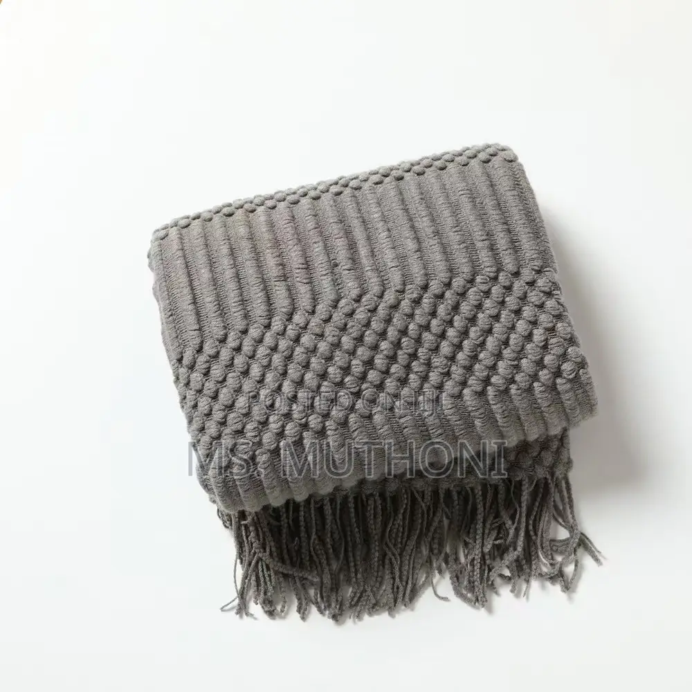 Textured Soft Knitted Throw Blanket With Tassels.