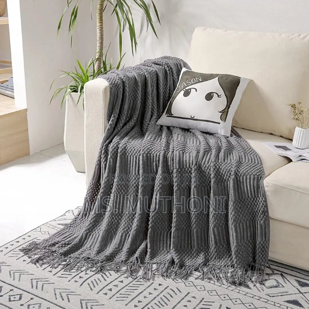 Textured Soft Knitted Throw Blanket With Tassels.