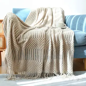 Textured Soft Knitted Throw Blanket With Tassels.