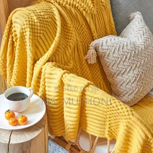 Textured Soft Knitted Throw Blanket With Tassels.