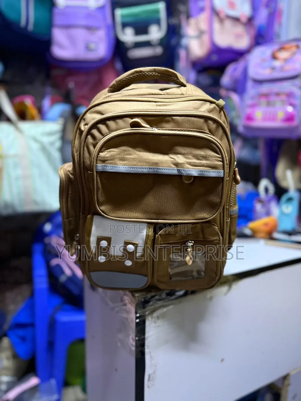 Brown Backpack Grade 1,2,3 at 1200 Each
