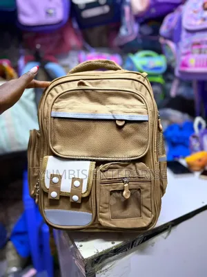 Brown Backpack Grade 1,2,3 at 1200 Each