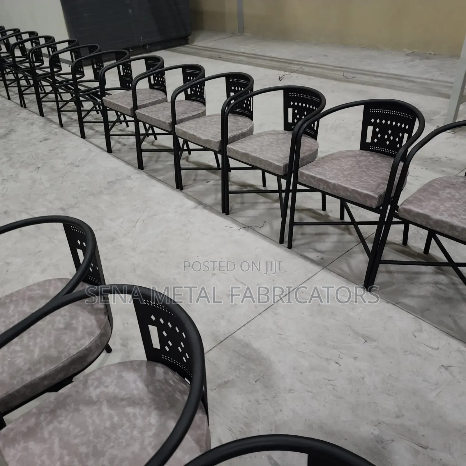 Gray Laser-Cut Metal Restaurant Chairs With Powder-Coated Finish.