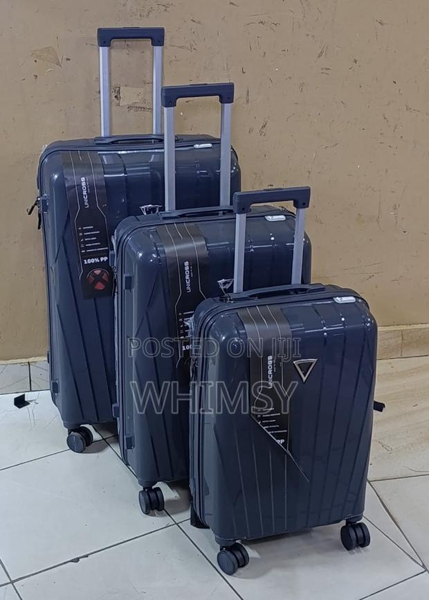 A Set of Three Unicross Unbreakable Rubber Suitcases - main view