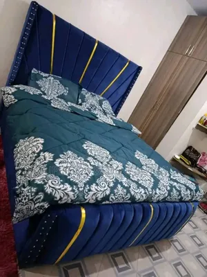 Blue Upholstered Bed With Gold Accents 5 by 6