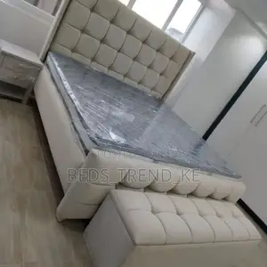 Envisioned 5 by 6 Bed With an Ottoman