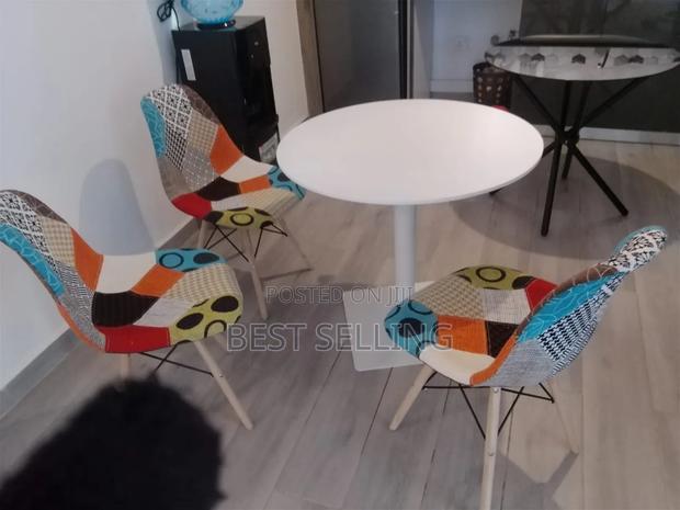 Round Eams Table With Leathered Eames Chairs