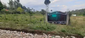 Fenced and Gated 1/4 Acre Plot in Ololua. Clean Title.