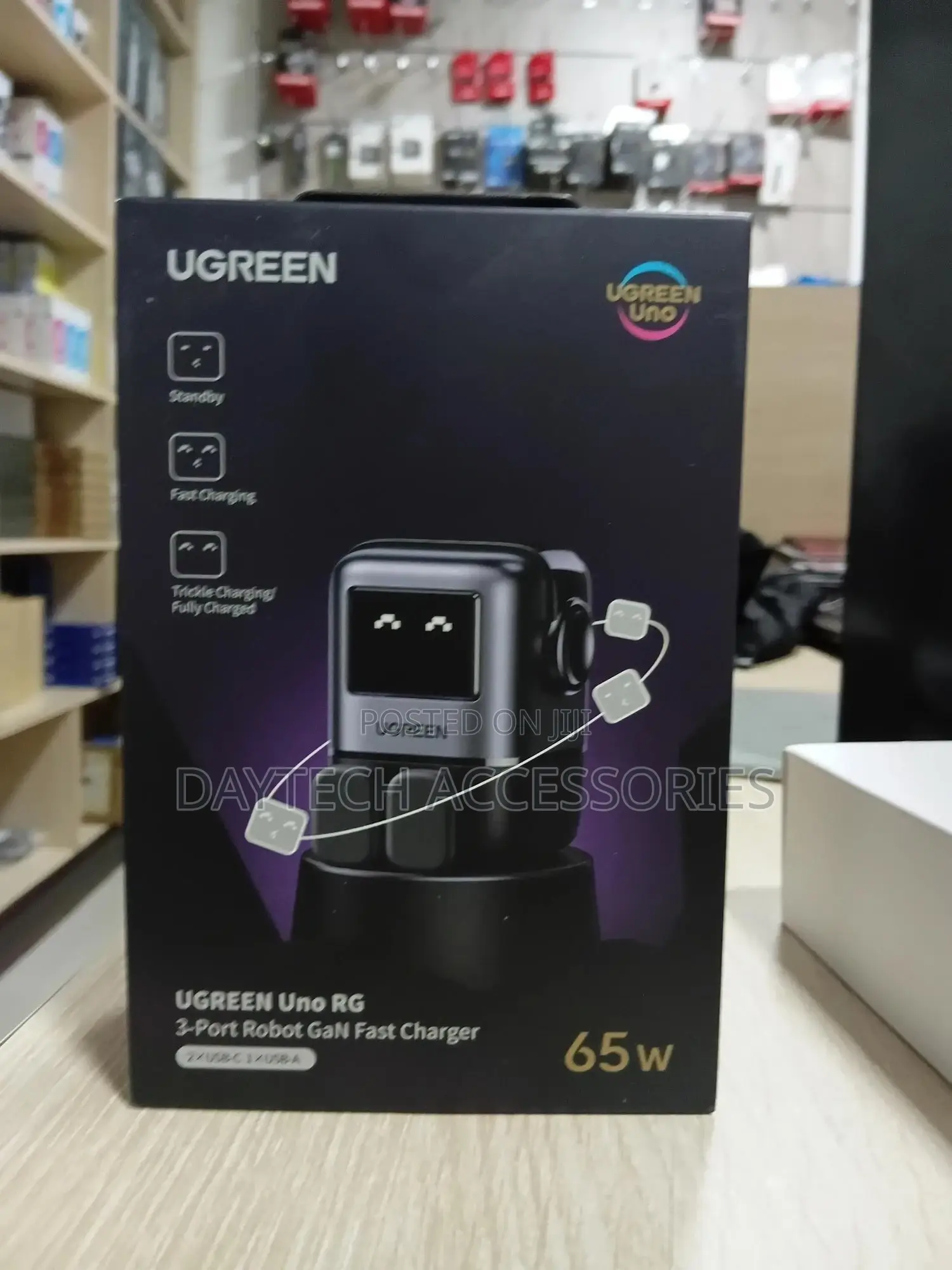 This Is a Ugreen Uno Rg 65w 3-Port Robot Gan Fast Charger.
