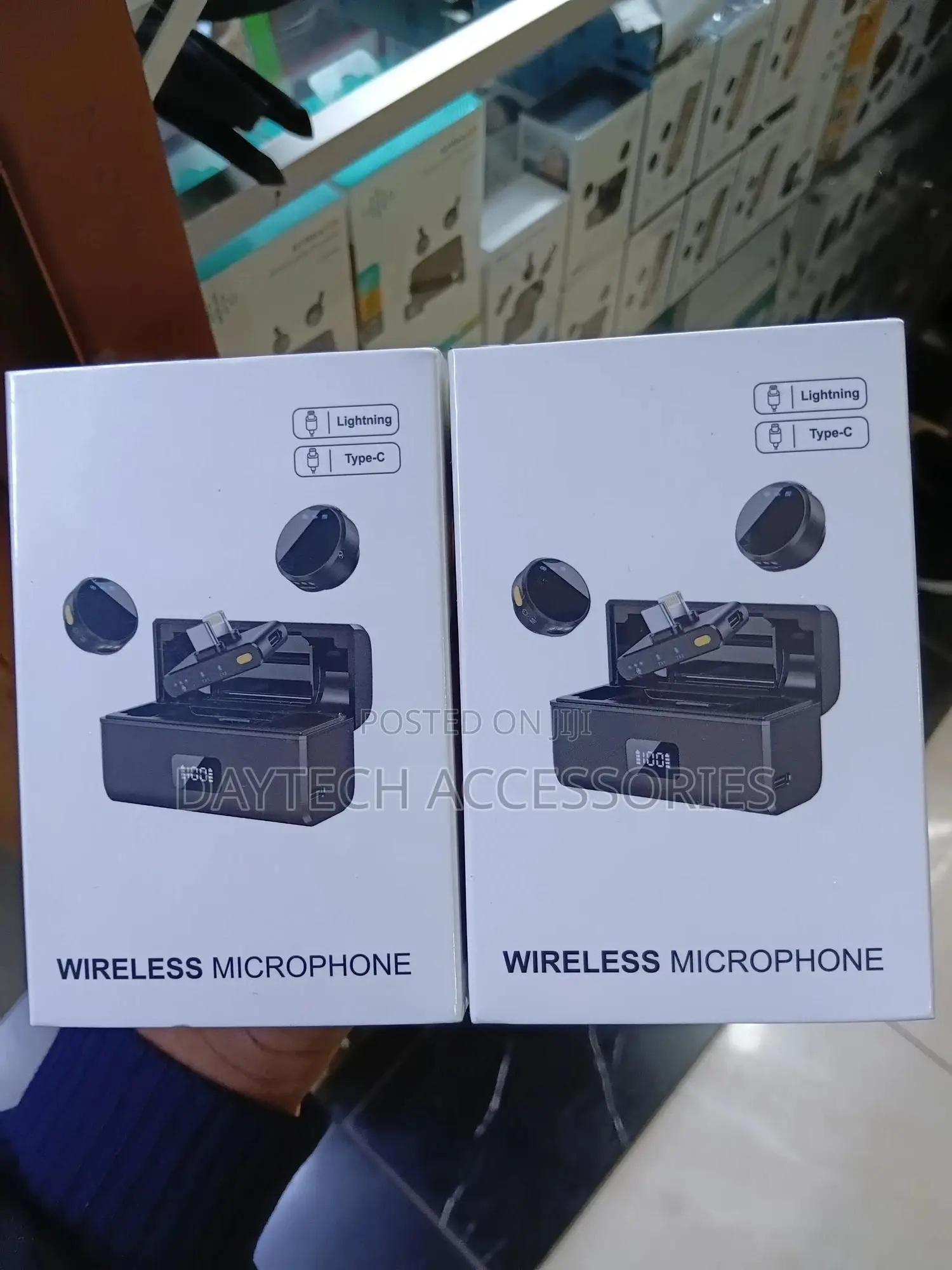 Dual Wireless Lavalier Microphone System With a Charging Case.