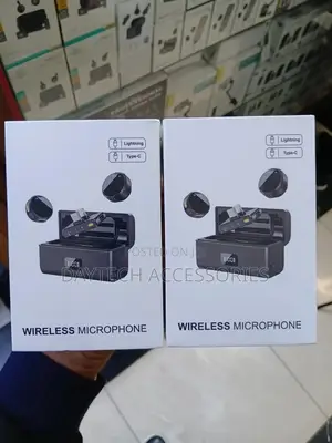 Dual Wireless Lavalier Microphone System With a Charging Case.