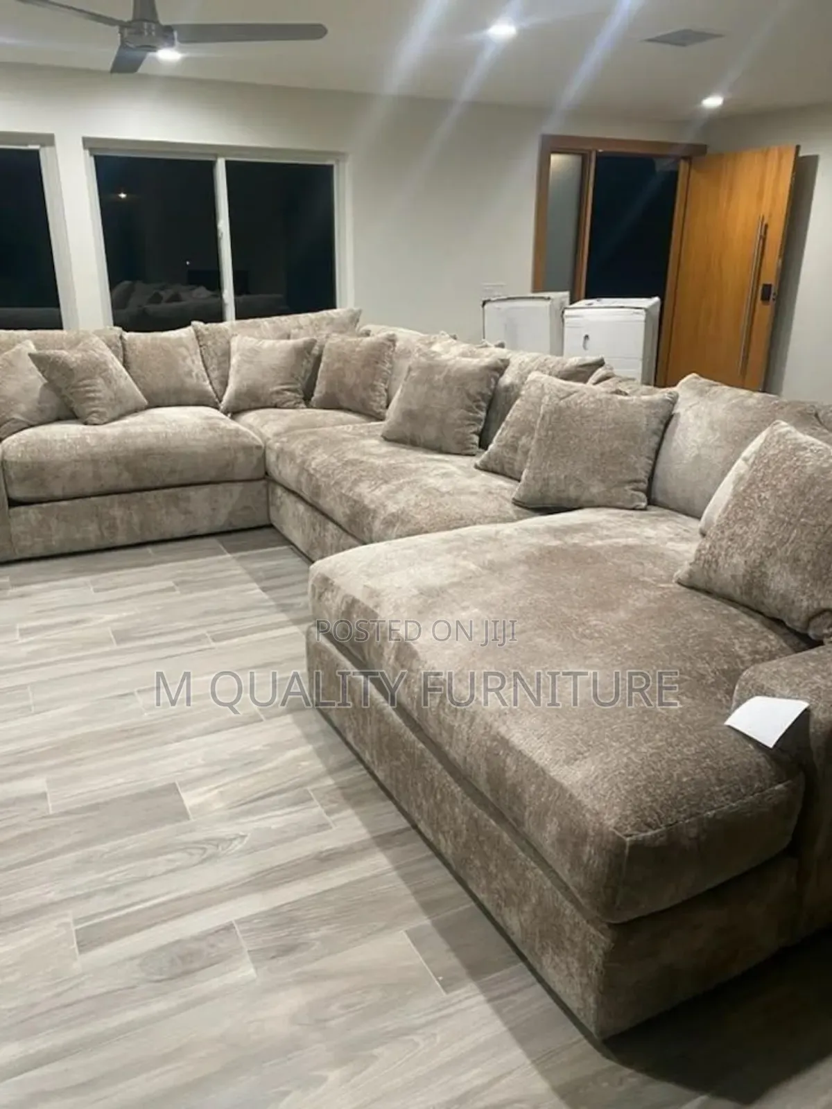 Brown U Shape Couch With Extra Pillows