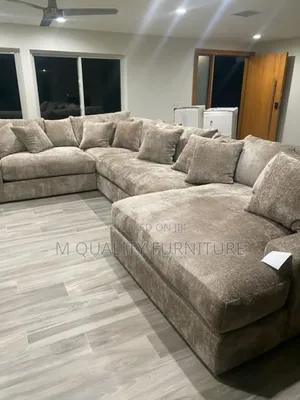 Brown U Shape Couch With Extra Pillows