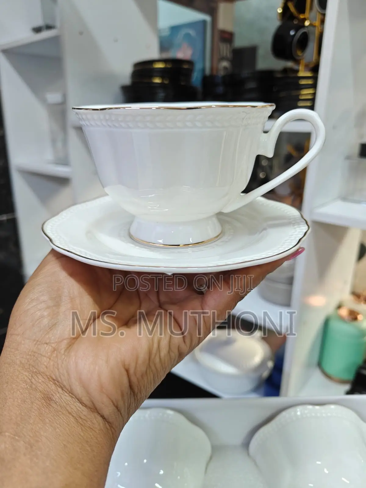 White 12-Piece Porcelain Tea Set With Gold Trim.