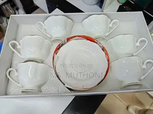 White 12-Piece Porcelain Tea Set With Gold Trim.