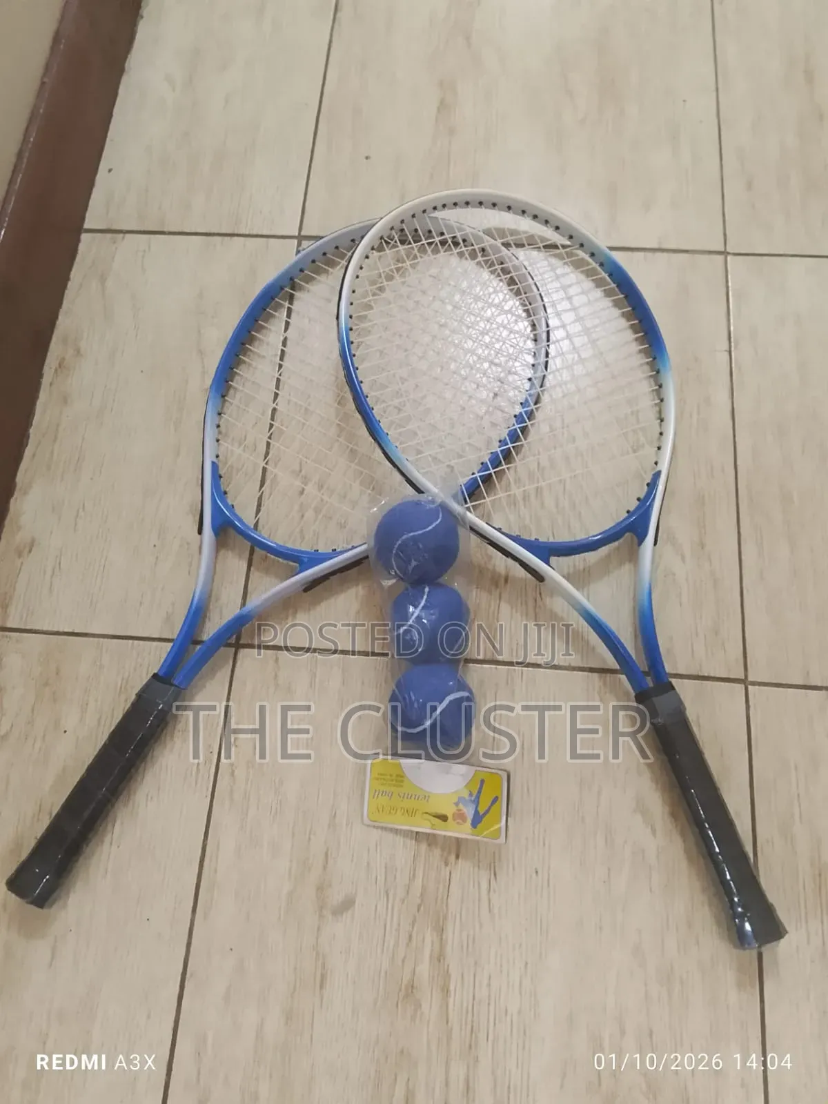 Pair or Tennis Rackets and 3 Tennis Ball