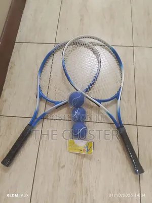 Pair or Tennis Rackets and 3 Tennis Ball