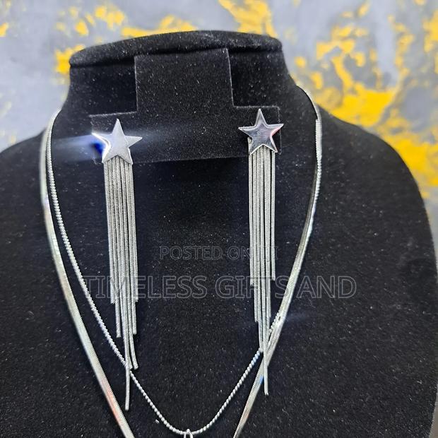 Silver Star Earrings and Star and Moon Layered Necklace - thumbnail 3