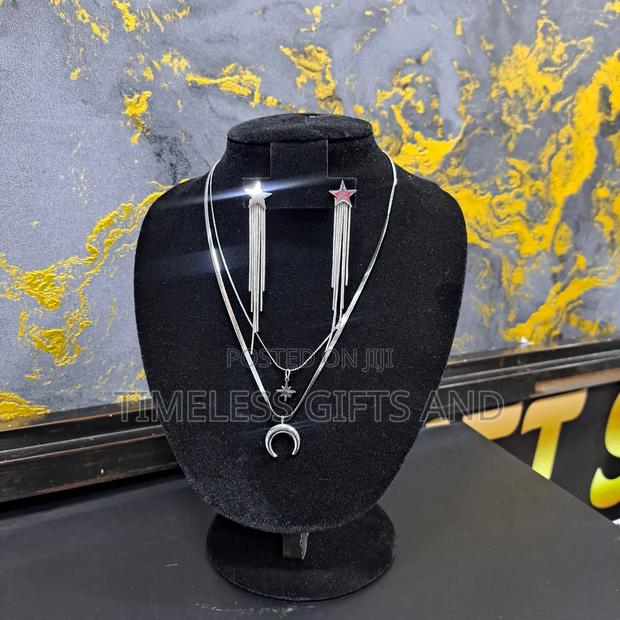 Silver Star Earrings and Star and Moon Layered Necklace - thumbnail 4