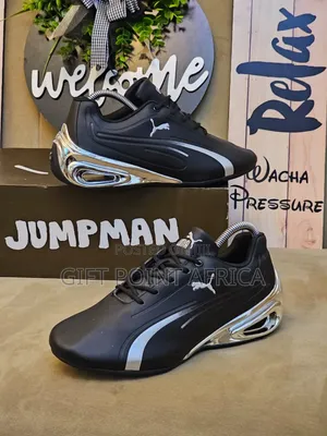 Black Puma Super Gt Sneakers With Silver Accents.
