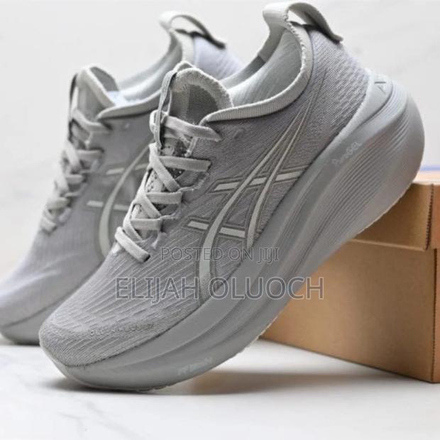 Asics Gel-Nimbus 27 Running Shoes in a Light Grey Colorway.