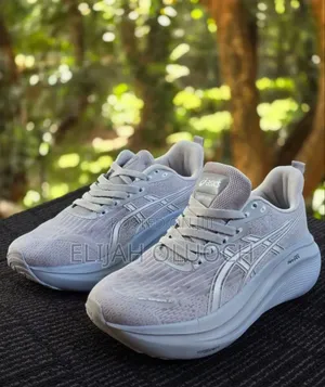 Asics Gel-Nimbus 27 Running Shoes in a Light Grey Colorway.