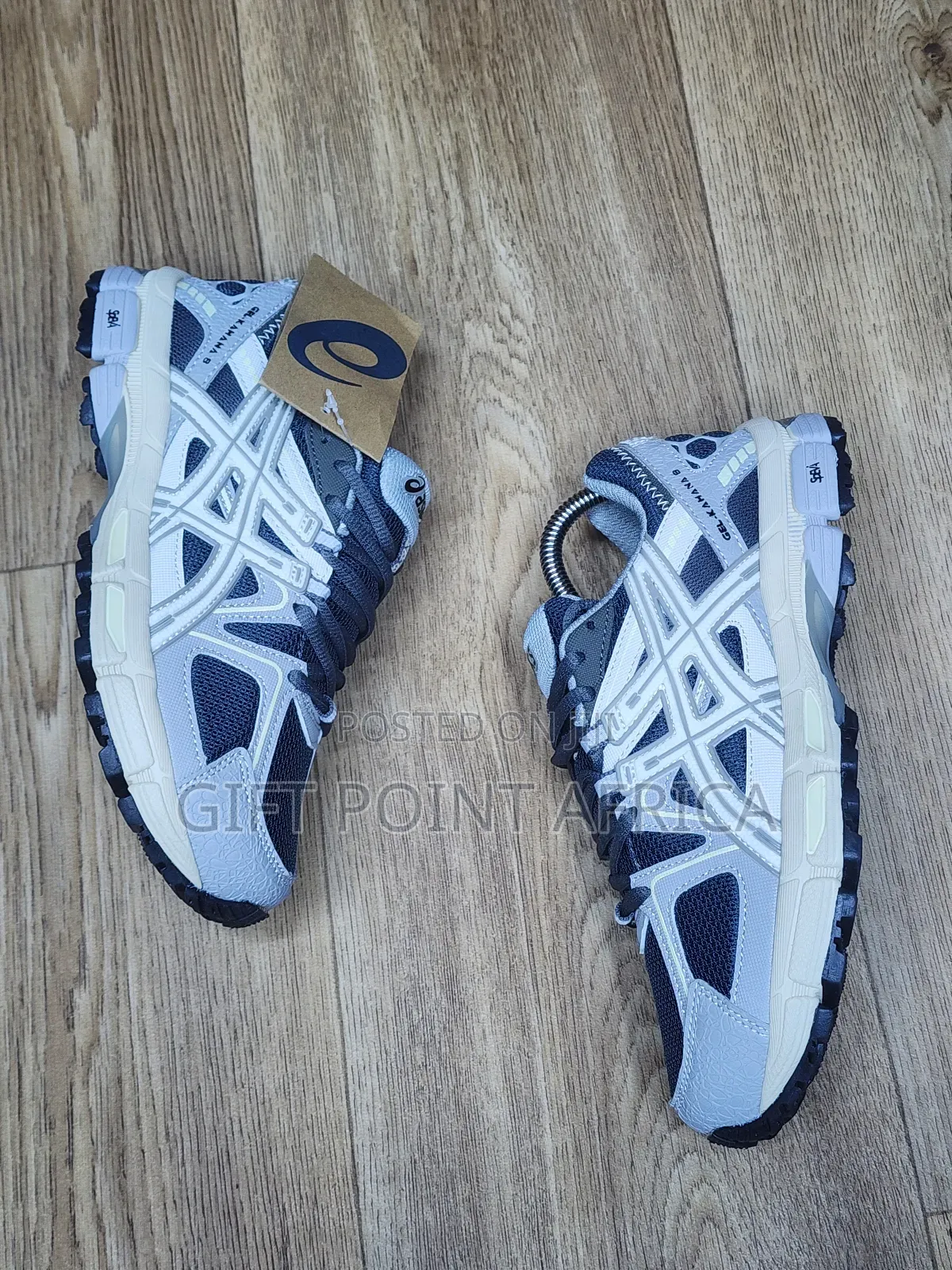 An Asics Gel-kahana 8 Sneaker, Likely In A Grey And White