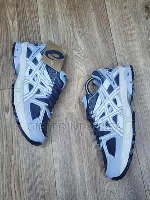 An Asics Gel-kahana 8 Sneaker, Likely In A Grey And White
