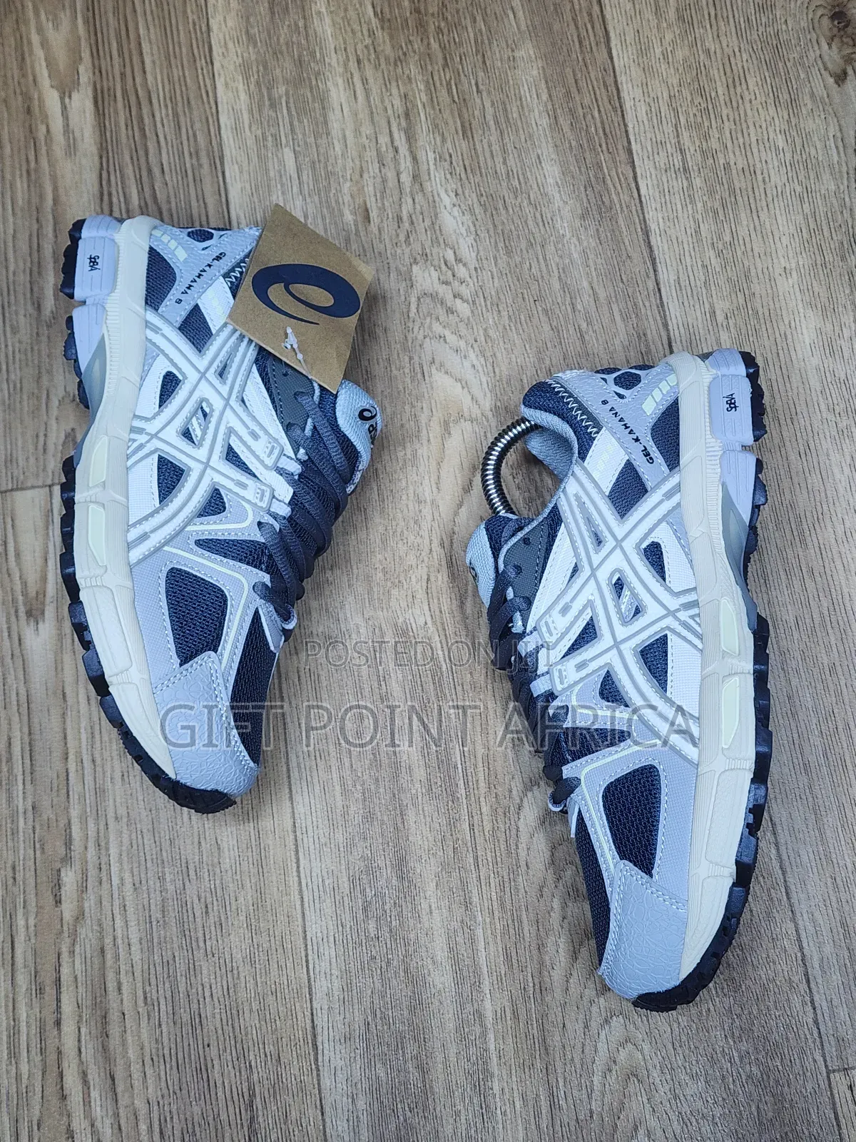 An Asics Gel-kahana 8 Sneaker, Likely In A Grey And White