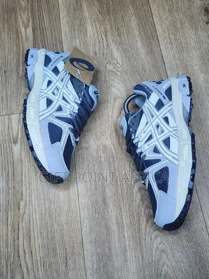 An Asics Gel-kahana 8 Sneaker, Likely In A Grey And White