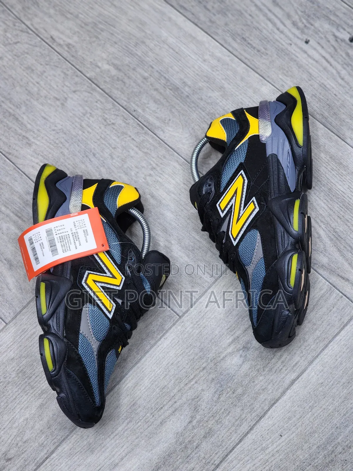 New Balance 9060 Sneakers In A Black, Grey, And Yellow